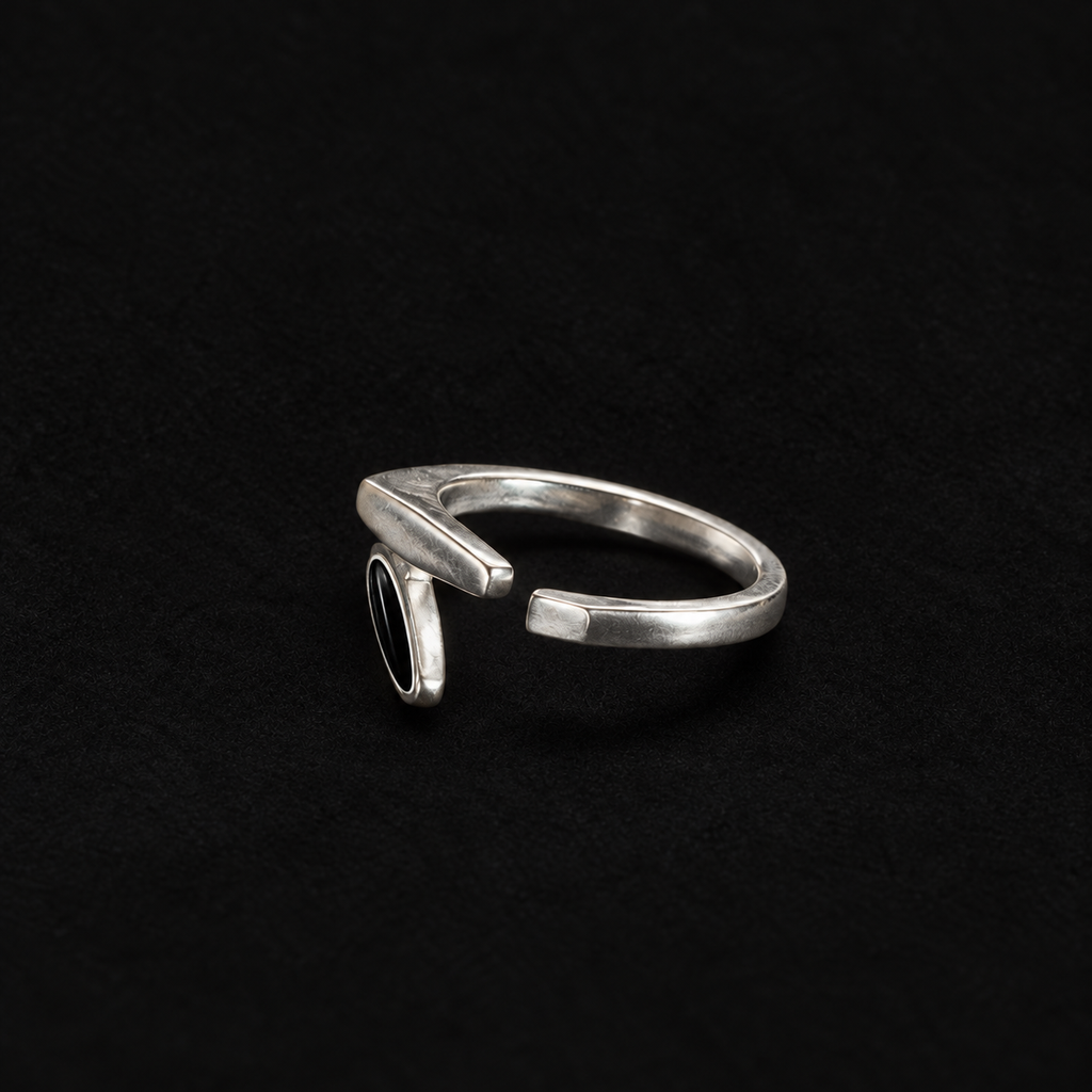 Close detail of the Shard Marquise Open Ring surface and finish