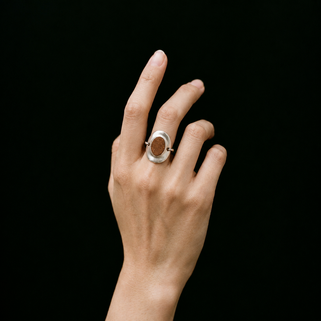 Model wearing the Inlay Signet Ring seen from the front