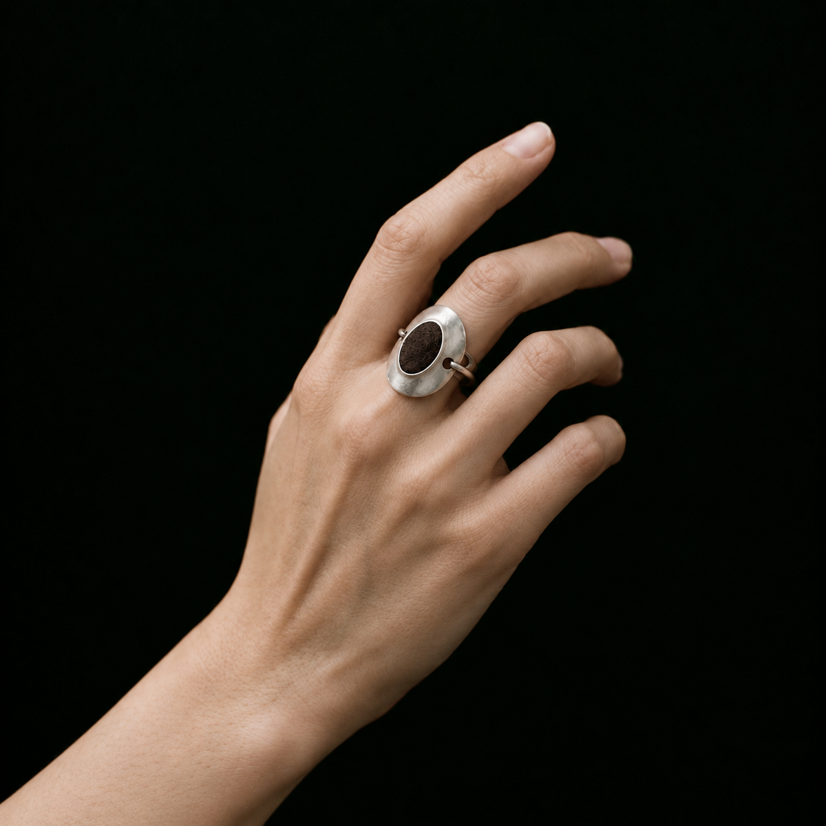 Model wearing the Inlay Signet Ring in a close crop