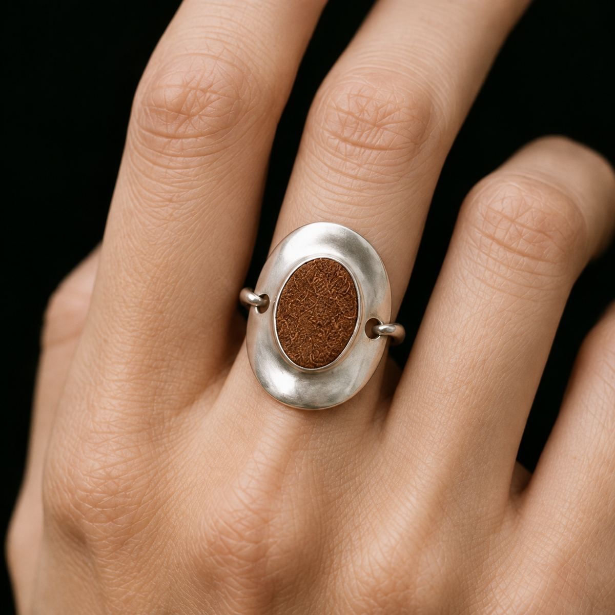 Model wearing the Inlay Signet Ring in a relaxed pose