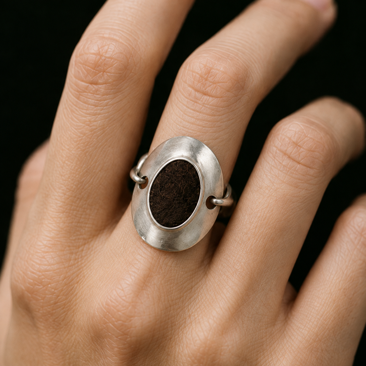 Model wearing the Inlay Signet Ring from a low angle
