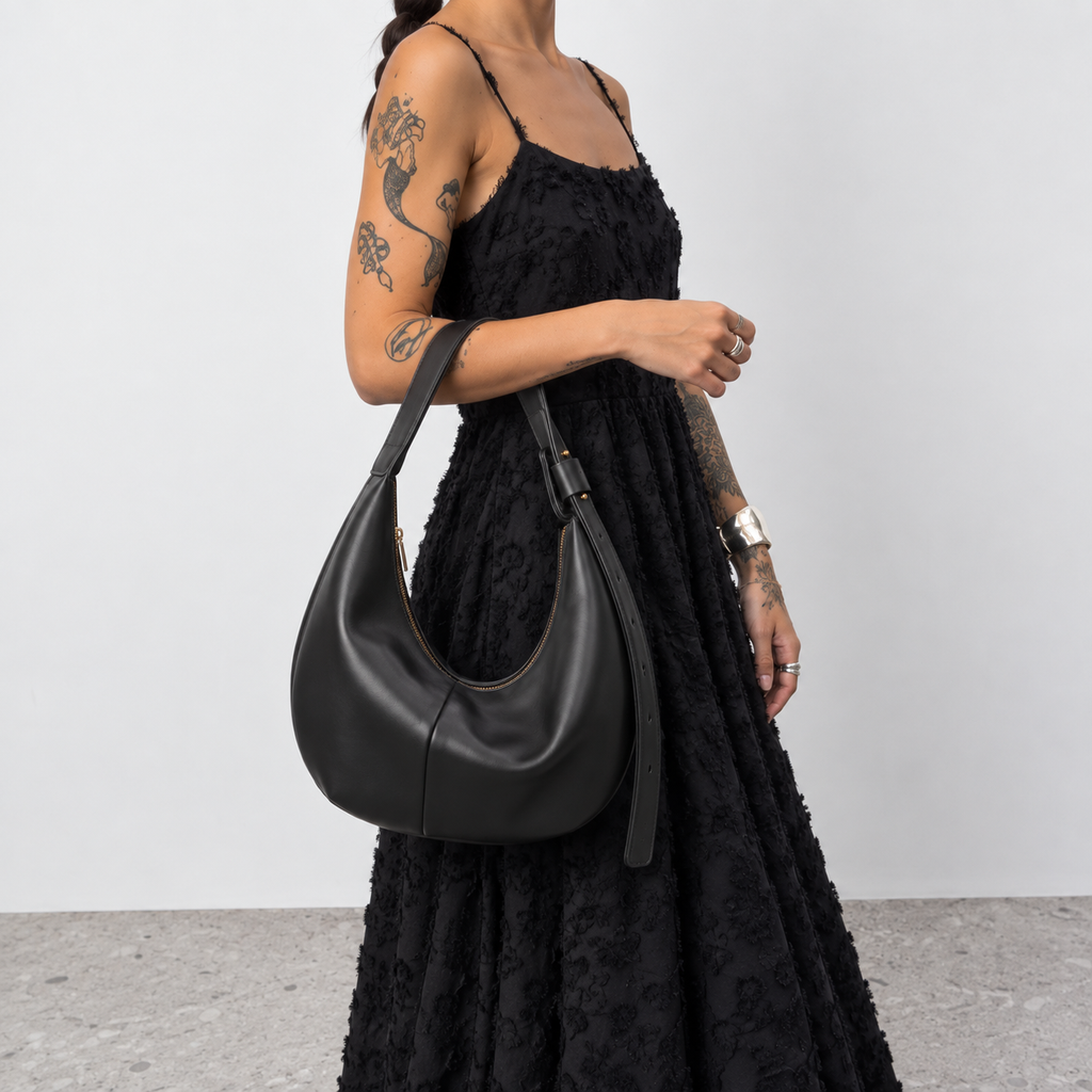 Full length shot of a model carrying the Lil Cacti crescent shoulder bag