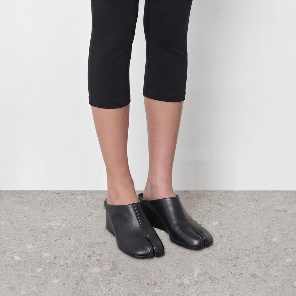 Model wearing Solene Tabi Wedge Slides by Lil Cacti, view 2