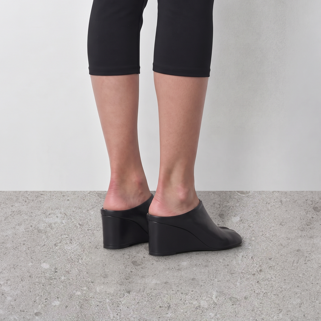Model wearing Solene Tabi Wedge Slides by Lil Cacti, view 4