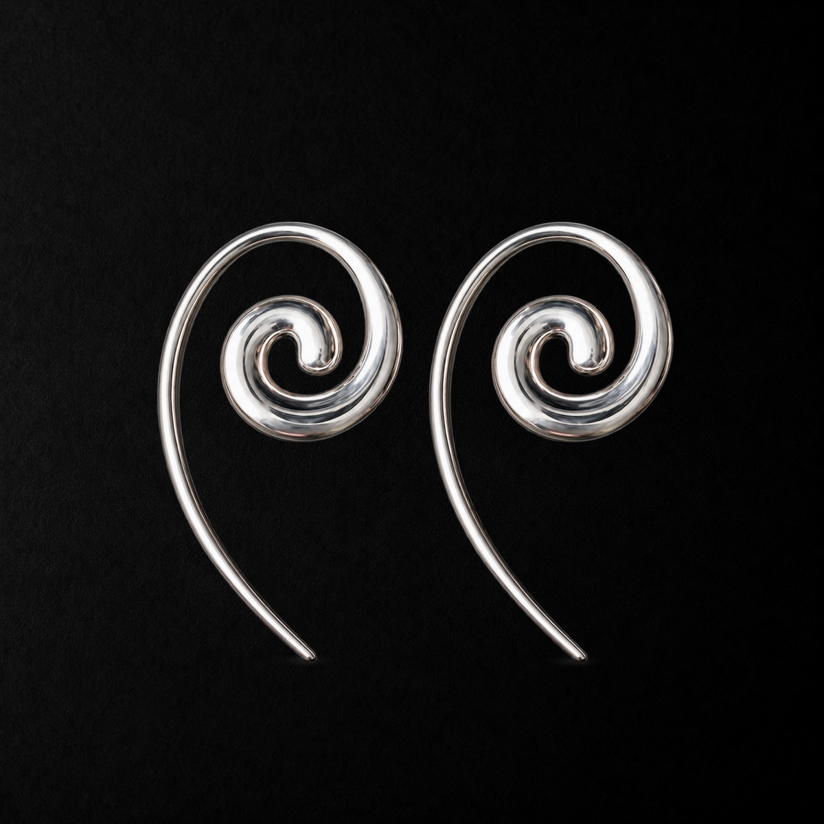 Spiral Coil Drop Earrings product shot from the side on a plain studio background