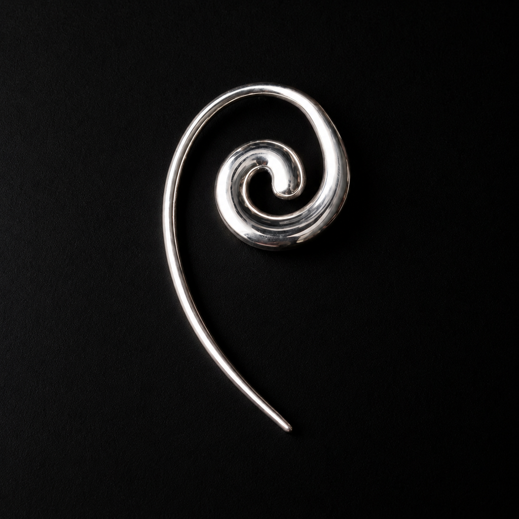 Spiral Coil Drop Earrings shown at a three quarter angle in studio light