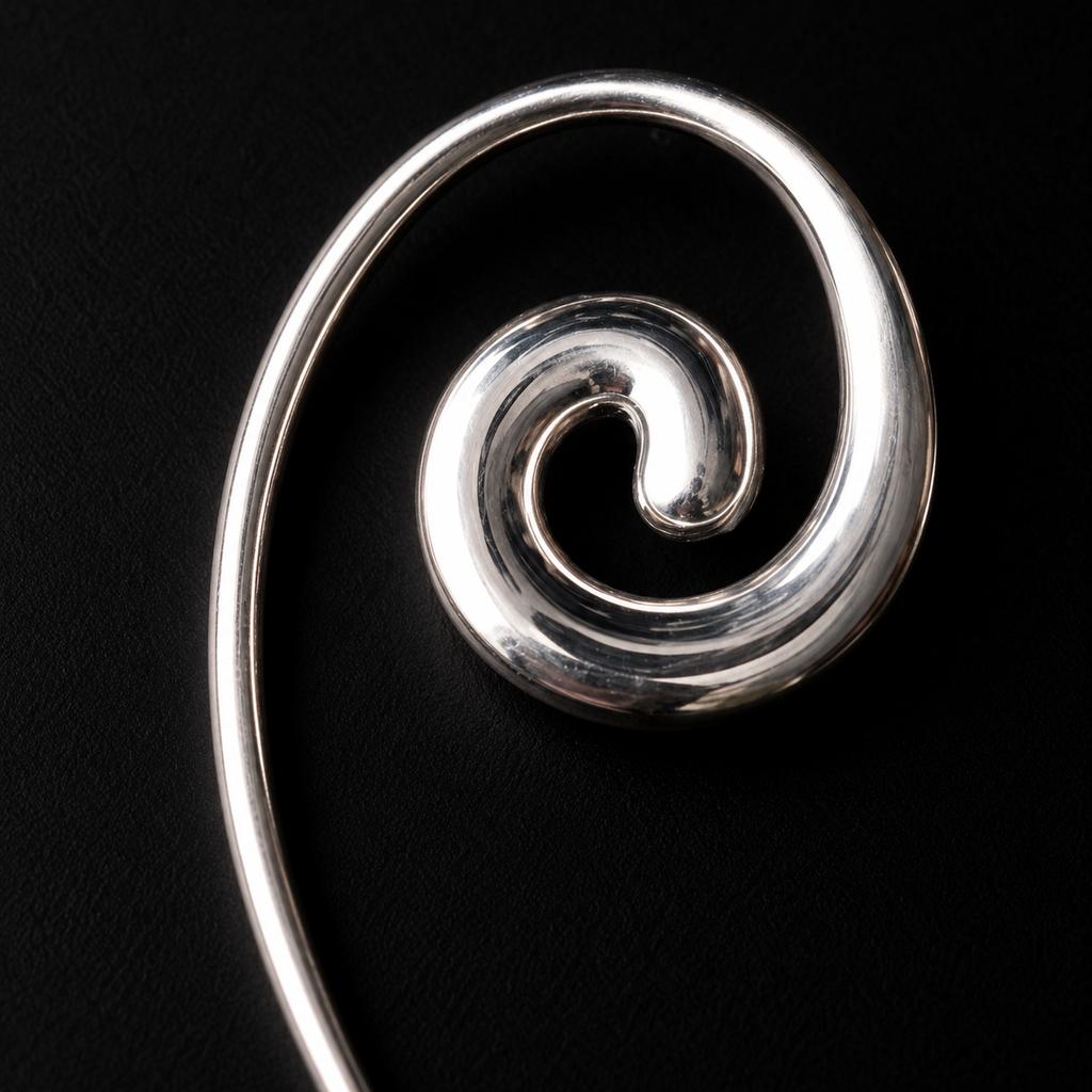 Back view of the Spiral Coil Drop Earrings in studio light