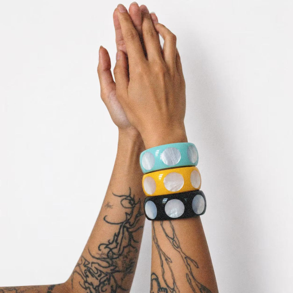 Model wearing the Spotted Chunky Bangle seen from the front
