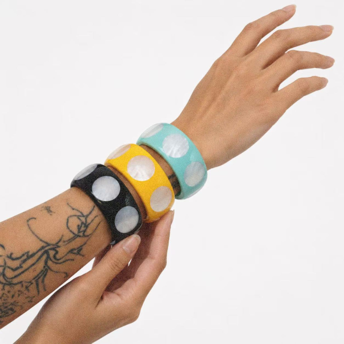 Model wearing the Spotted Chunky Bangle seen from the side