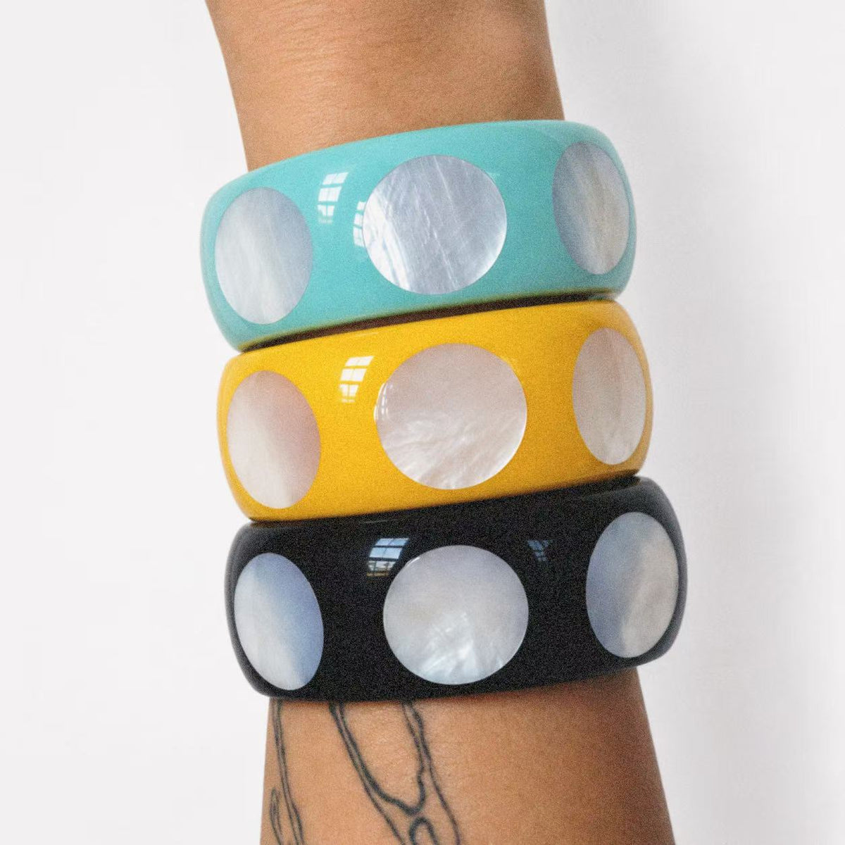 Model wearing the Spotted Chunky Bangle seen from behind