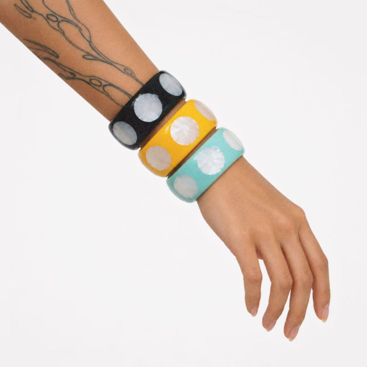 Model wearing the Spotted Chunky Bangle in a close crop
