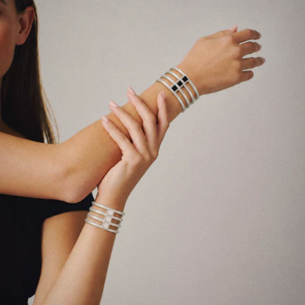 Model wearing the Strata Wide Cuff Bracelet, three quarter view