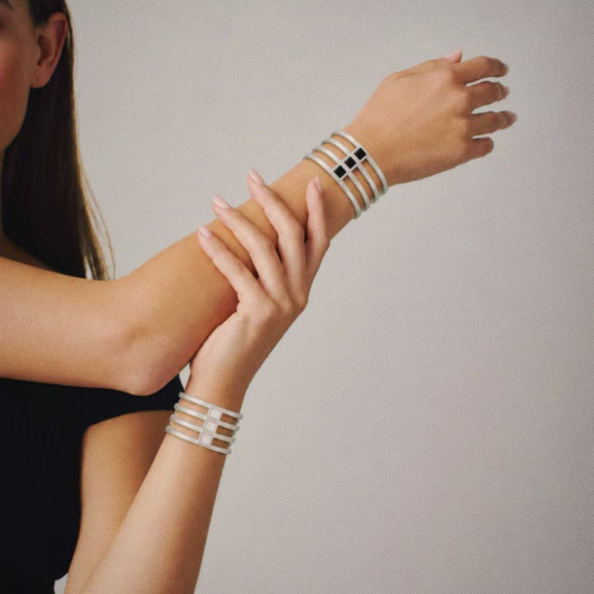 Model wearing the Strata Wide Cuff Bracelet, three quarter view