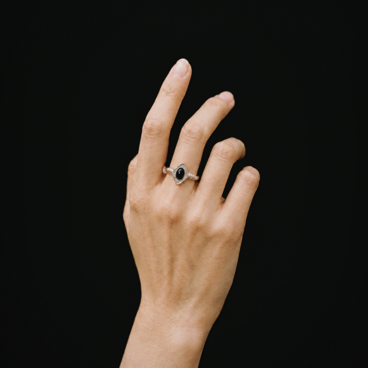 Model wearing Lil Cacti Art Deco adjustable ring in a close detail view