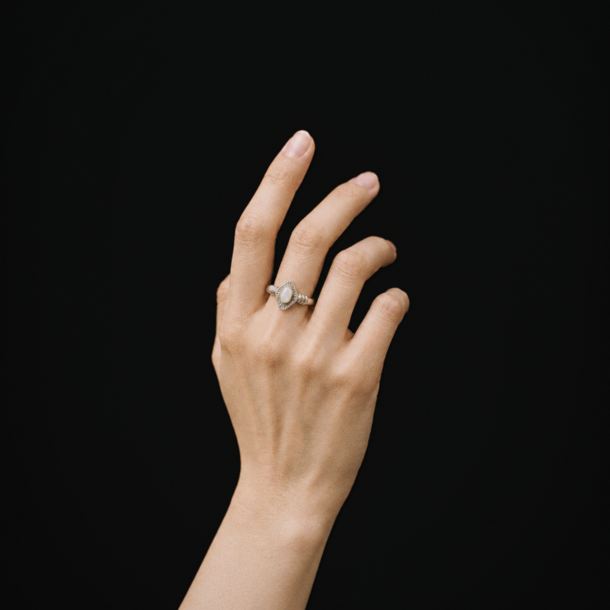 Model wearing Lil Cacti Art Deco adjustable ring in a close detail view