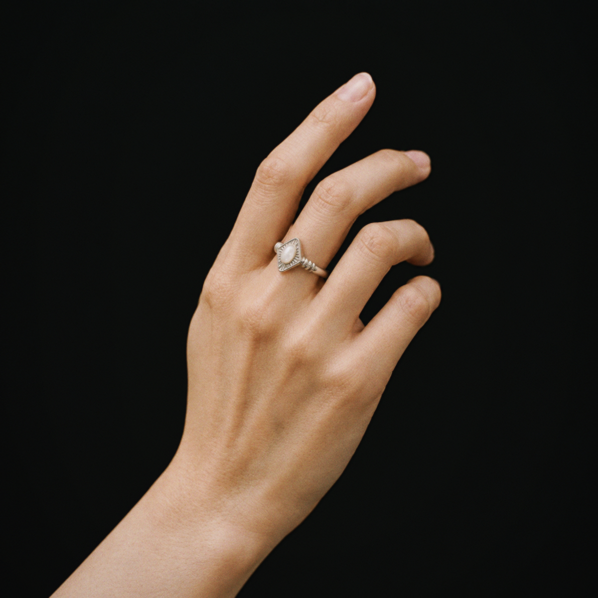 Model wearing Lil Cacti Art Deco adjustable ring in a close detail view
