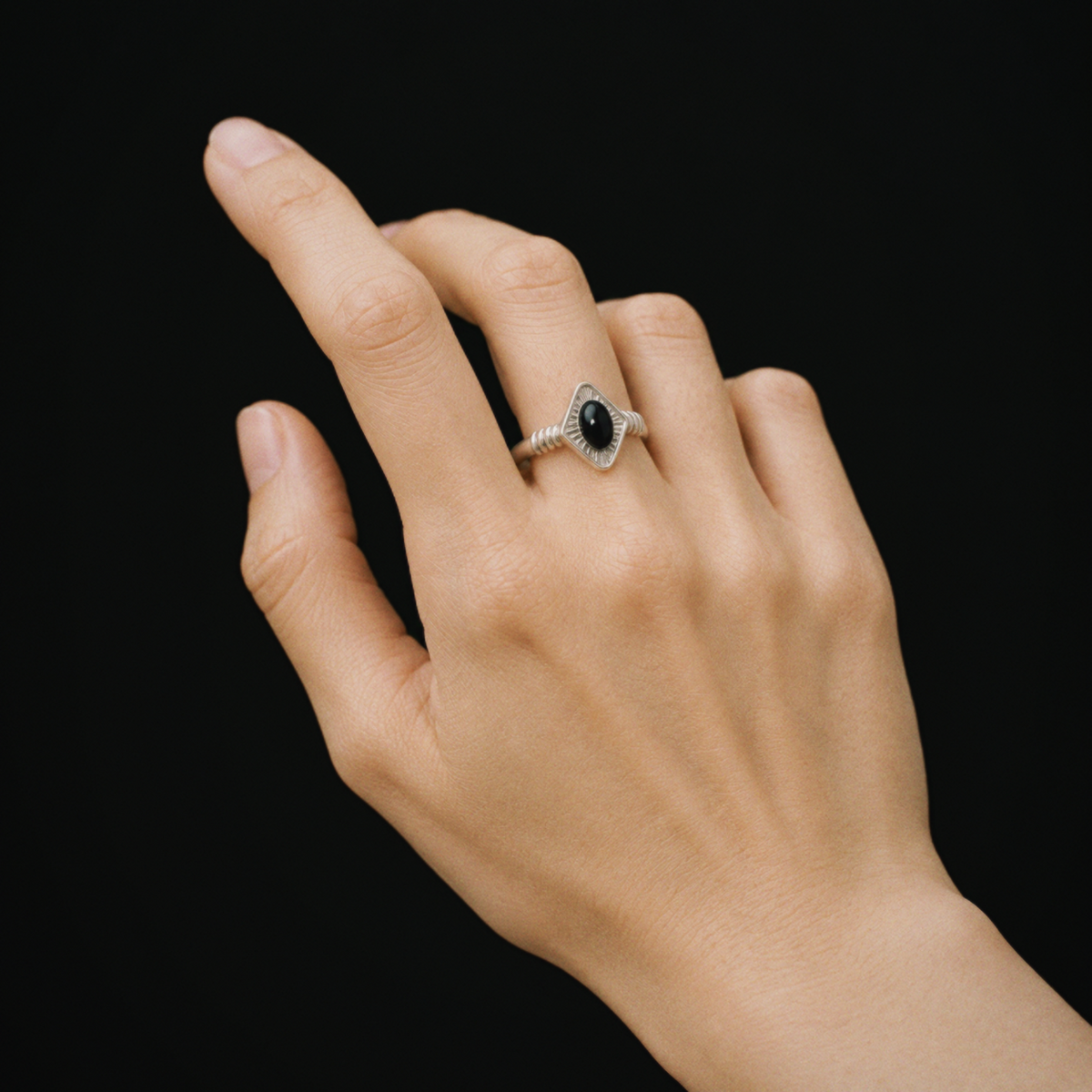 Model wearing Lil Cacti Art Deco adjustable ring in a close detail view