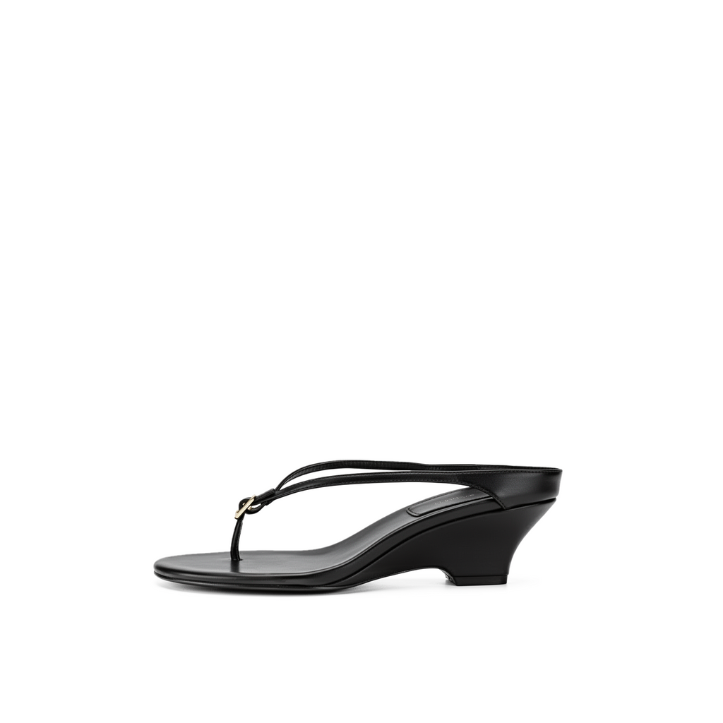 Suri black leather wedge thong sandals with slim double strap by Lil Cacti, side profile view