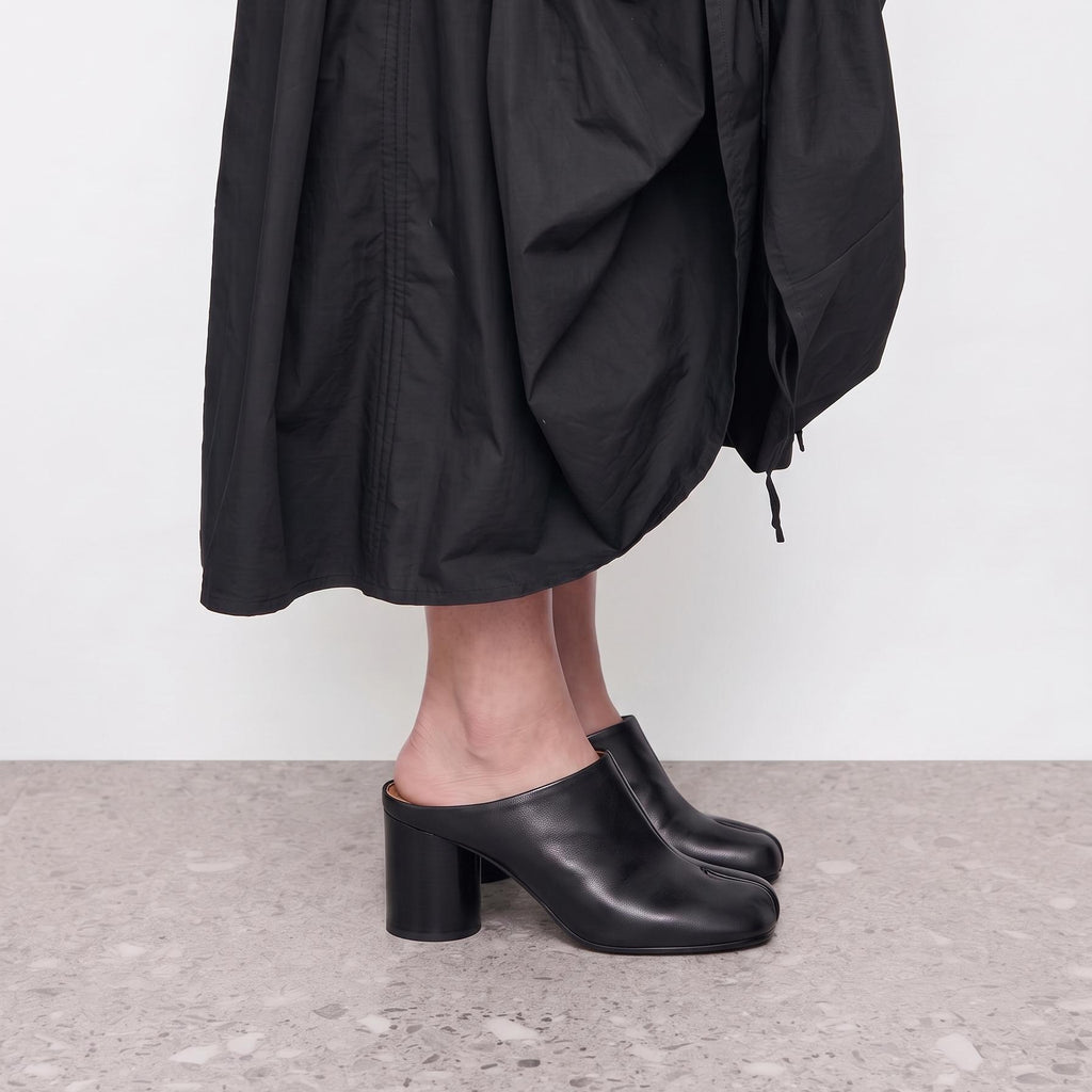 Model wearing Tavora Tabi Block Heel Mules by Lil Cacti in a standing pose