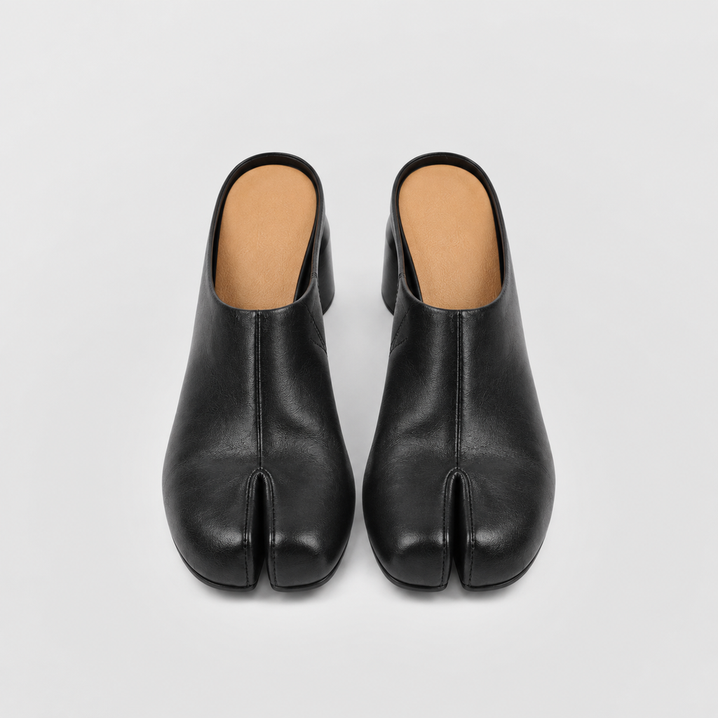 Pair of black tabi mules viewed from above showing the split-toe front