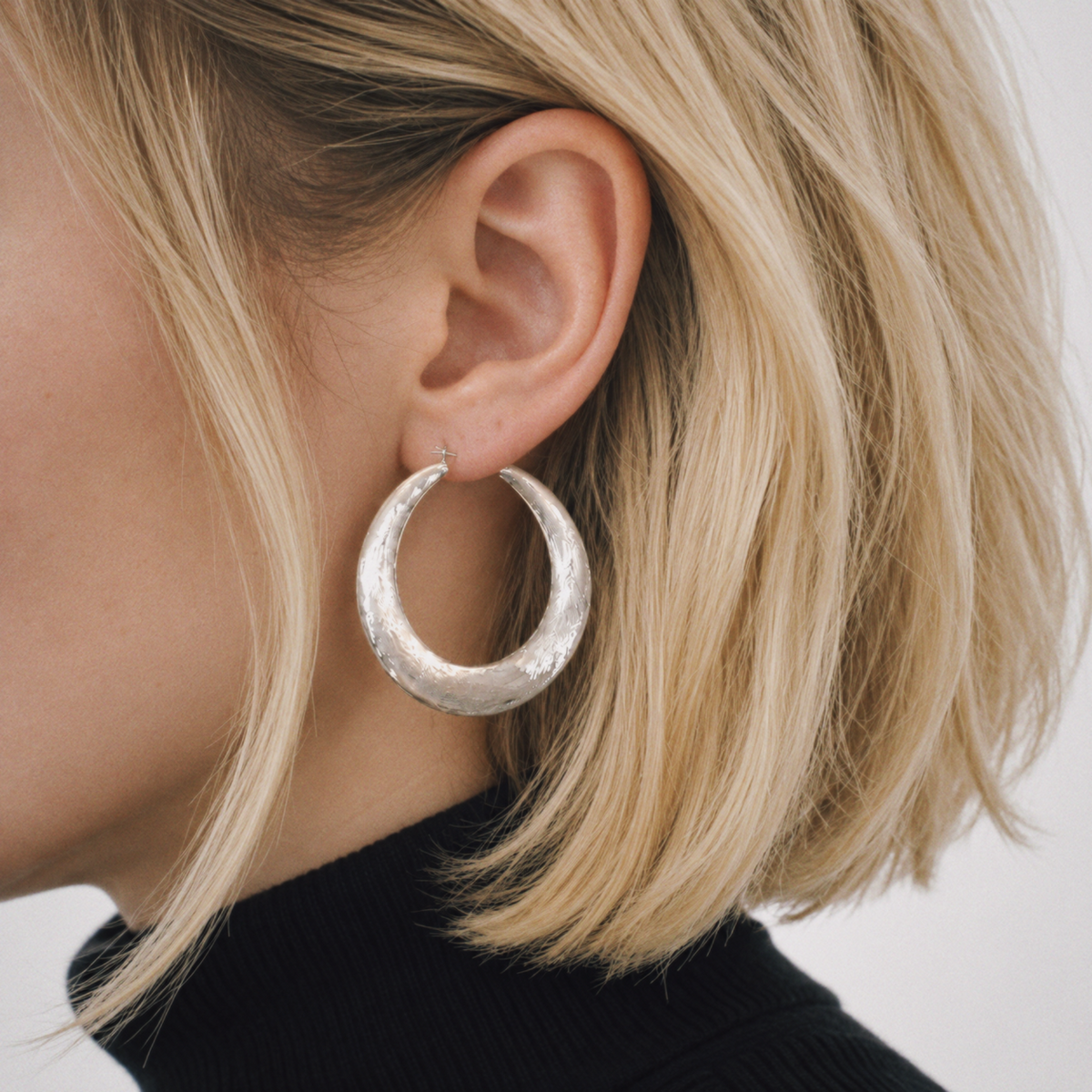 Model wearing Tide Hammered Hoop Earrings by Lil Cacti, view 2