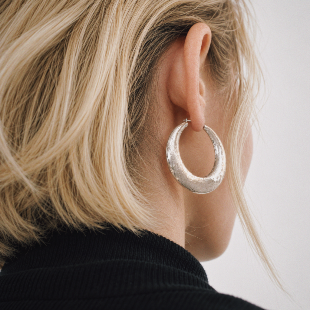 Model wearing Tide Hammered Hoop Earrings by Lil Cacti, view 3