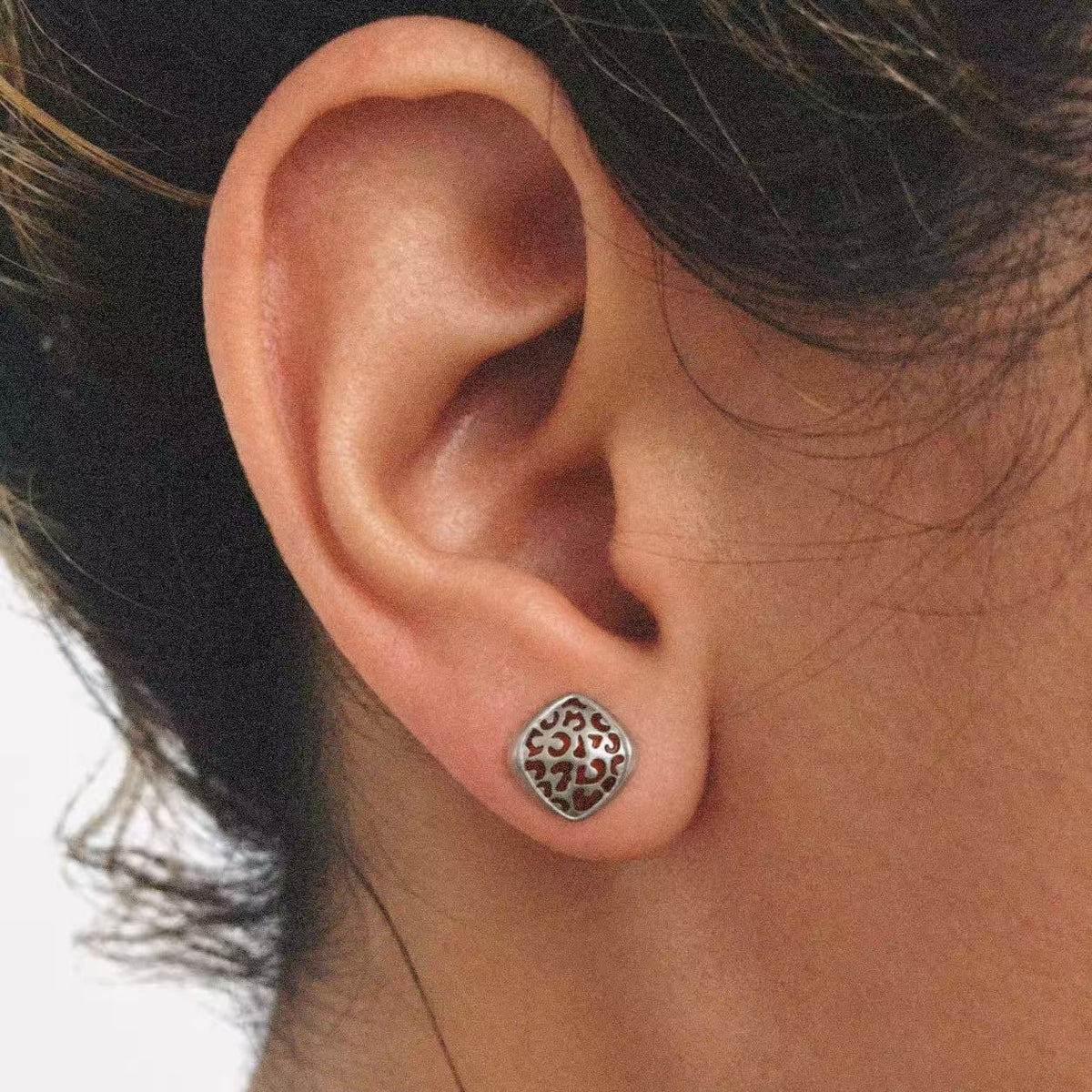 Mosaic Filigree Stud Earrings worn on the ear, filigree earrings