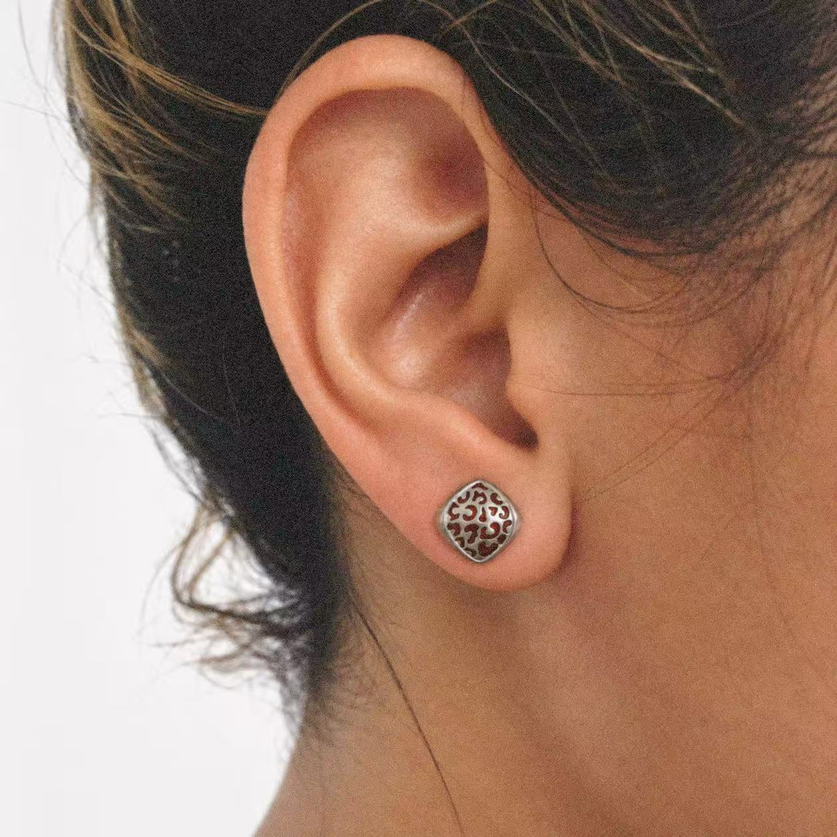 Close-up of the Mosaic Filigree Stud Earrings, showing the finish and shape up close