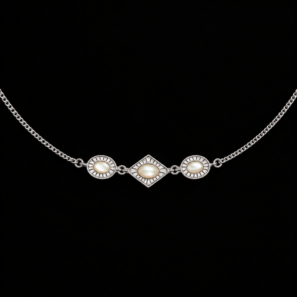 Close detail of the Triad Art Deco Station Necklace surface and finish