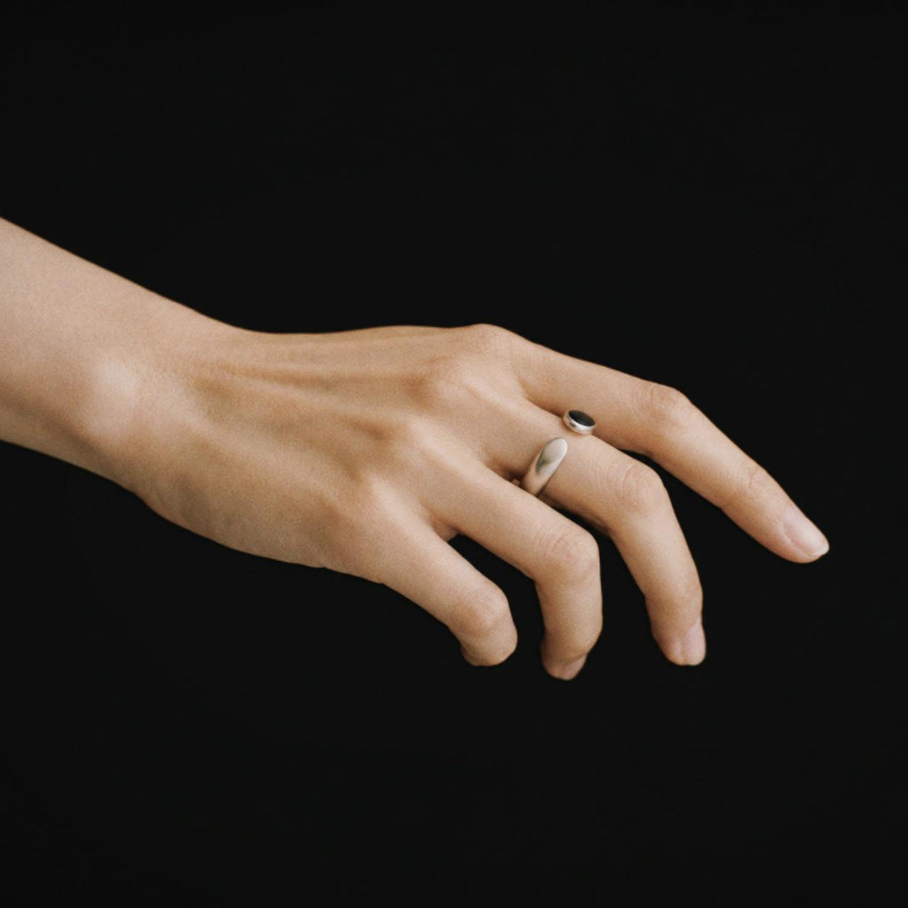 Model wearing the Umbra Oval Signet Ring, three quarter view