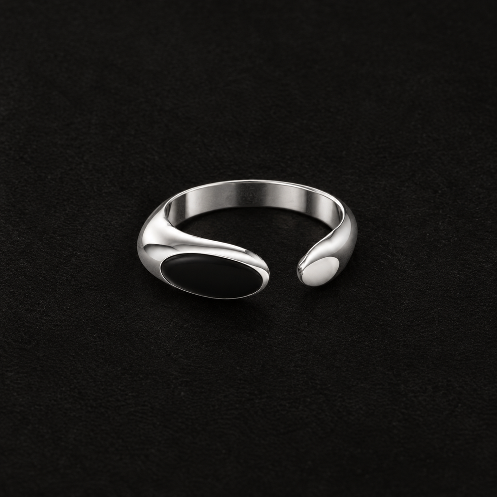Pair of Umbra Oval Signet Ring angled together on a dark background