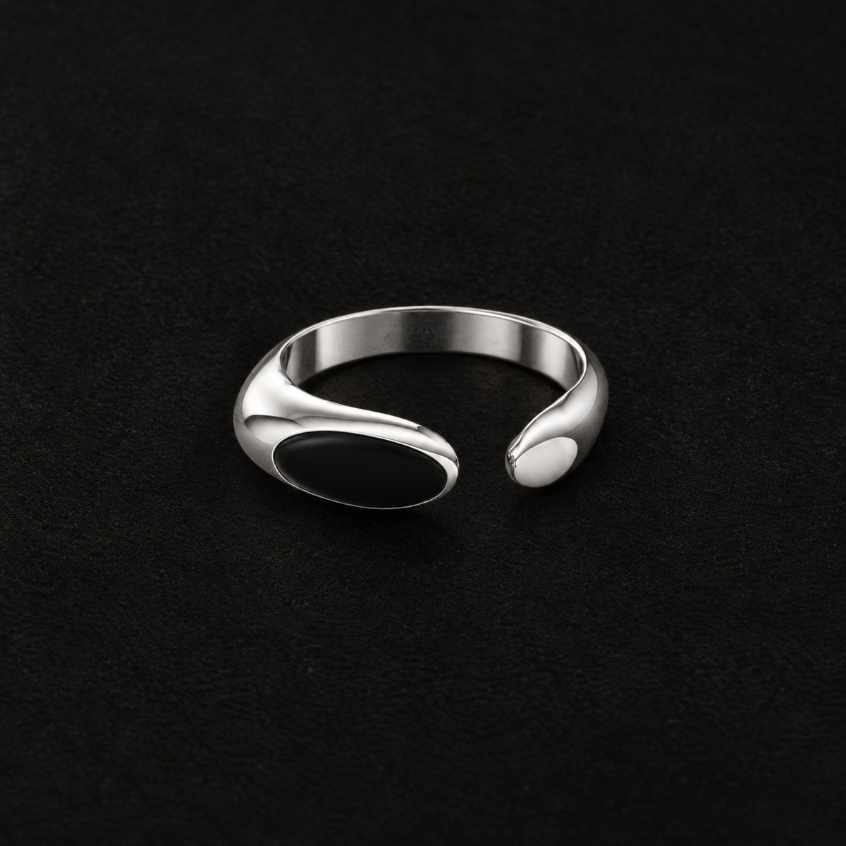 Pair of Umbra Oval Signet Ring angled together on a dark background