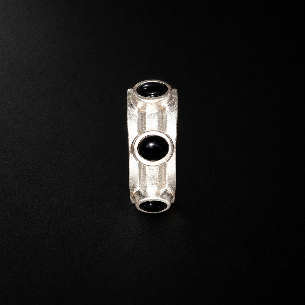 Close detail of the Vault Black Stone Hoop Earrings surface and finish