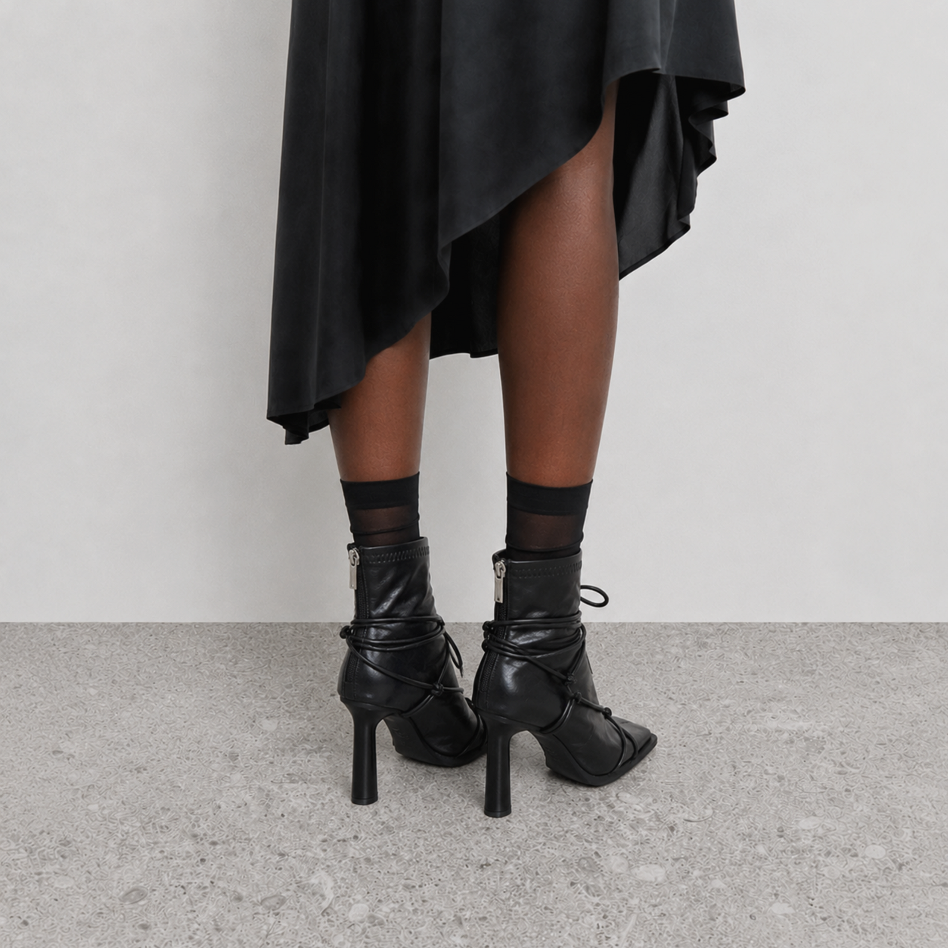 Verity Lace-Up Square Toe Boots by Lil Cacti — on-model back view showing back zips and slim heels with a midi skirt