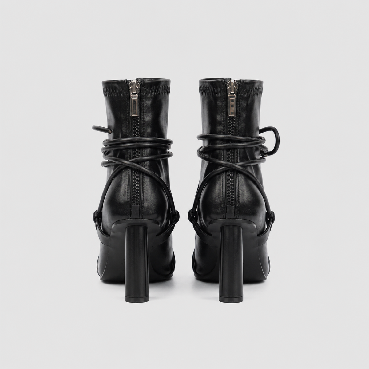 Verity Lace-Up Square Toe Boots by Lil Cacti — pair back view showing silver back zips, wrapped cords and slim round heels