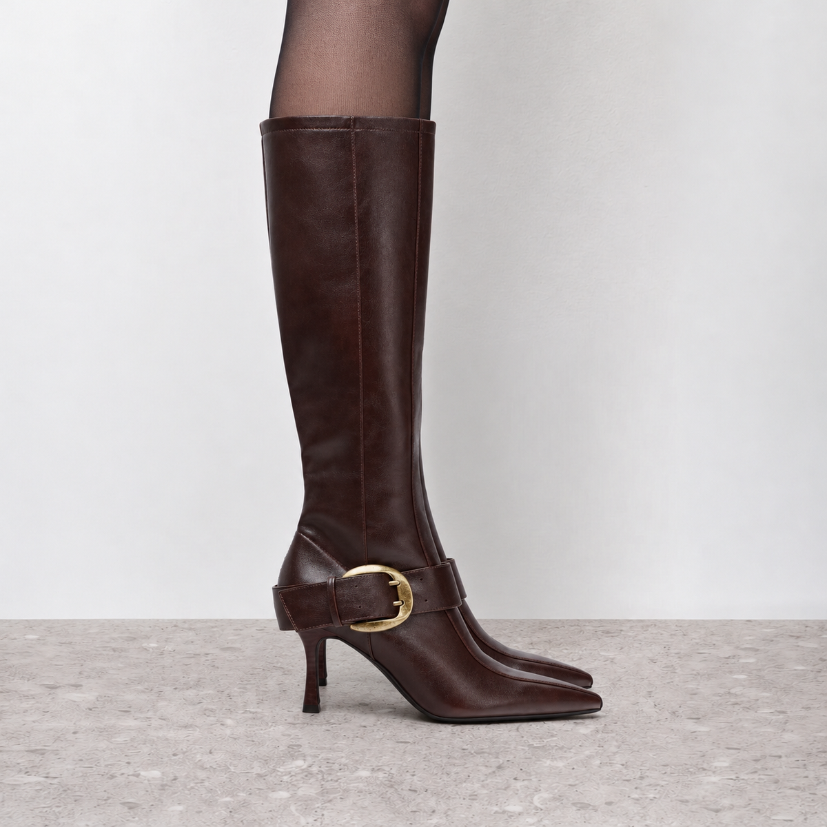 Model wearing Vesper Buckle Tall Boots in dark brown, full-length product styling view