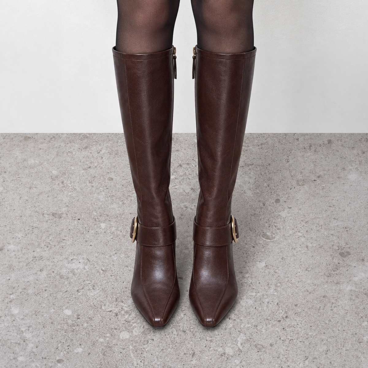Model wearing Vesper Buckle Tall Boots in dark brown, alternate full-length styling view