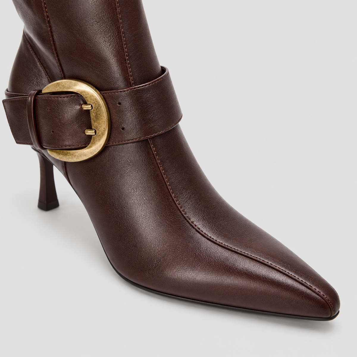 Close-up of Vesper Buckle Tall Boots in dark brown, highlighting the upper and finish