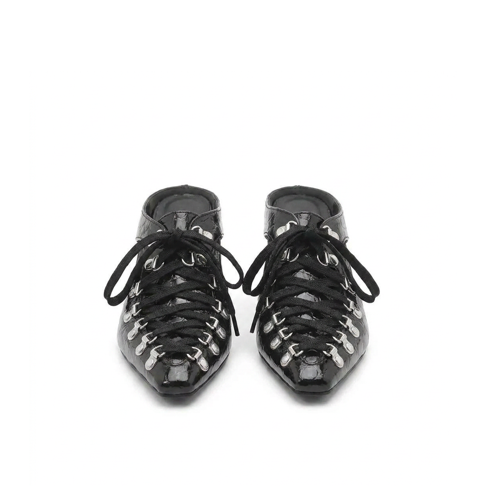 Close-up of sculptural cutout heel on Vex patent mules