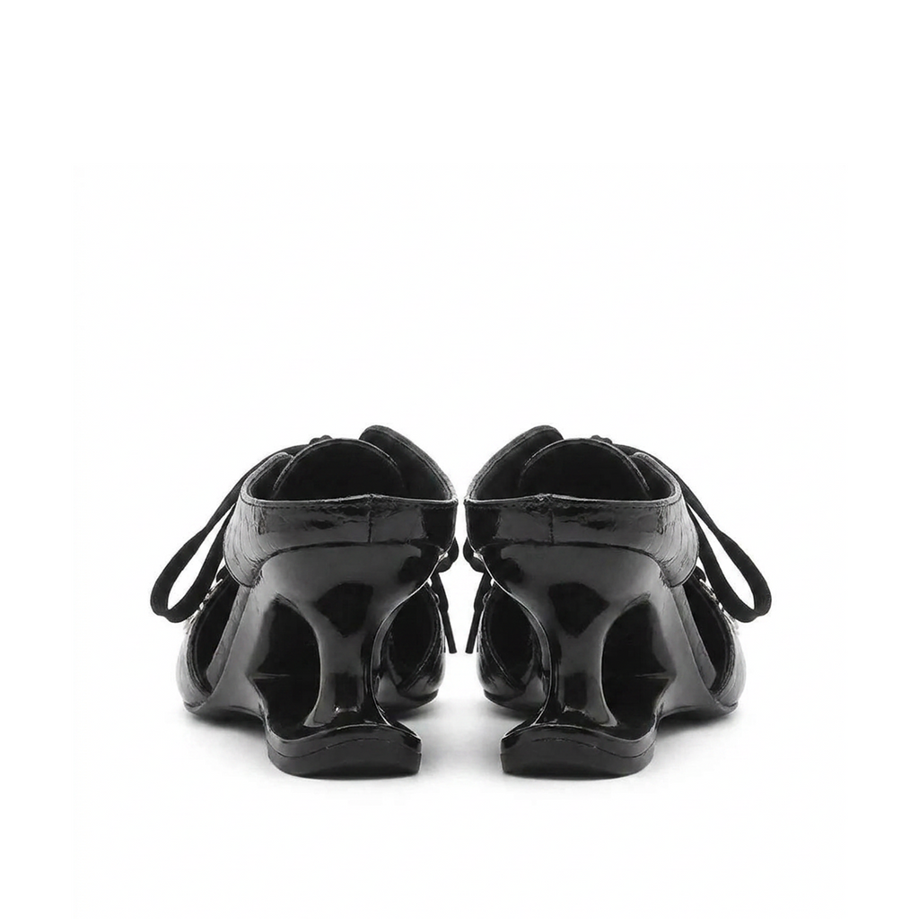 Black patent mules with pointed toe and lace-up detail