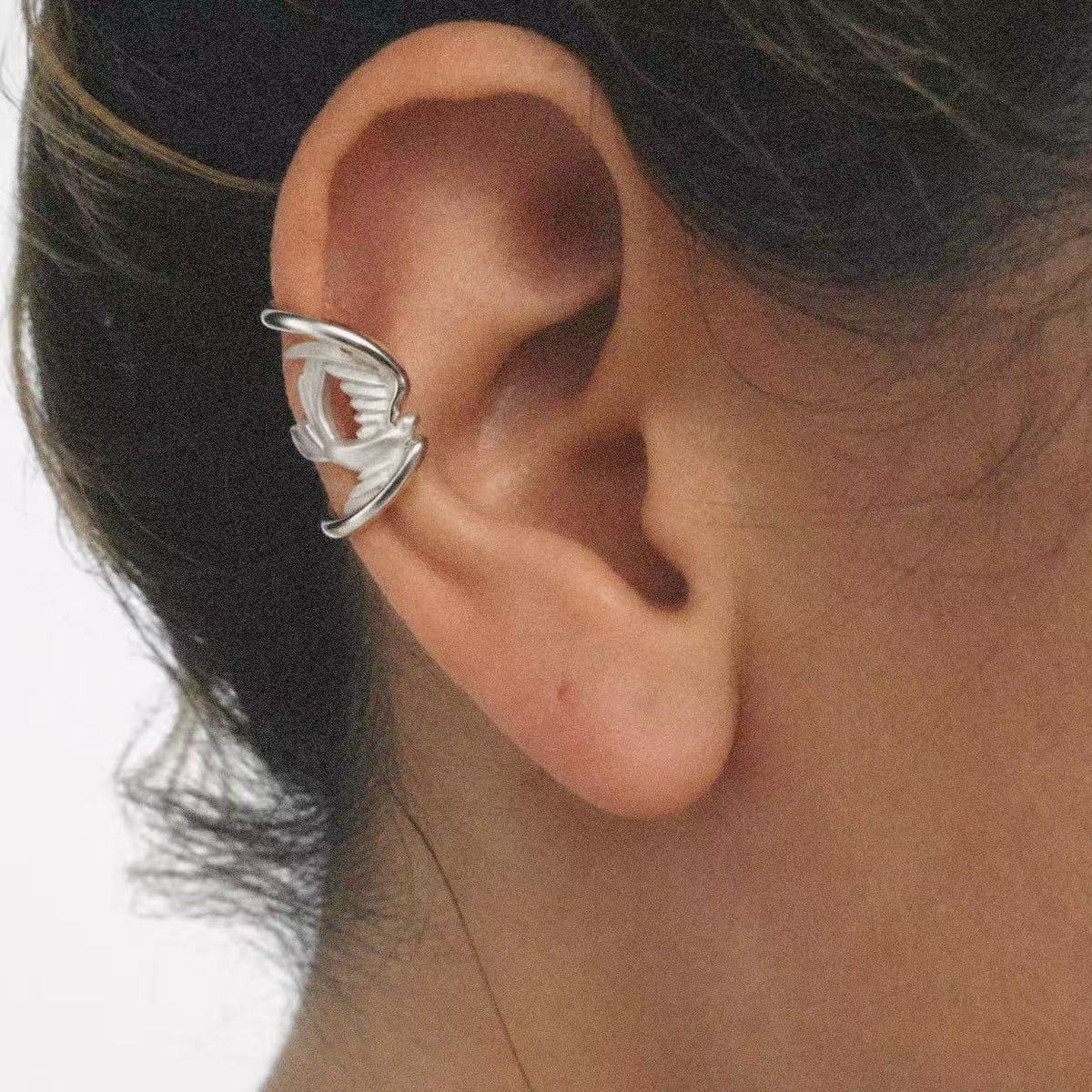 Model wearing the Wing Wrap Ear Cuff seen from the front
