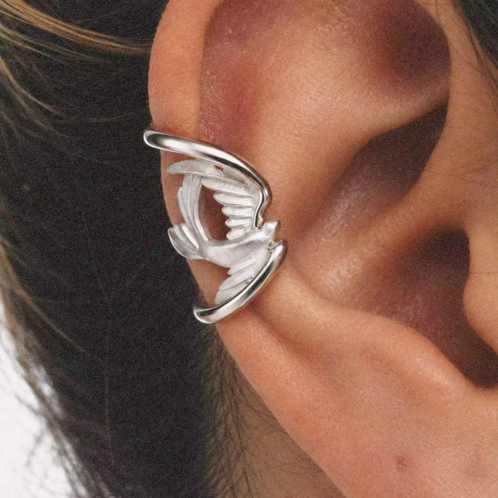 Model wearing the Wing Wrap Ear Cuff in a relaxed pose