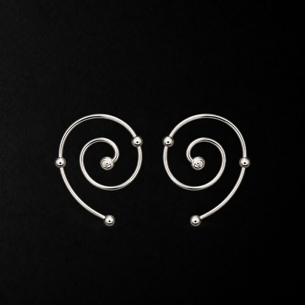 Wire Spiral Ear Climbers product shot from the side on a plain studio background