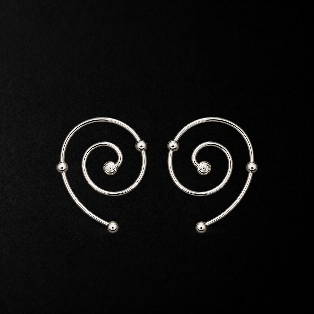 Wire Spiral Ear Climbers product shot from the side on a plain studio background