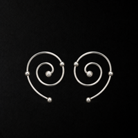 Wire Spiral Ear Climbers product shot from the side on a plain studio background