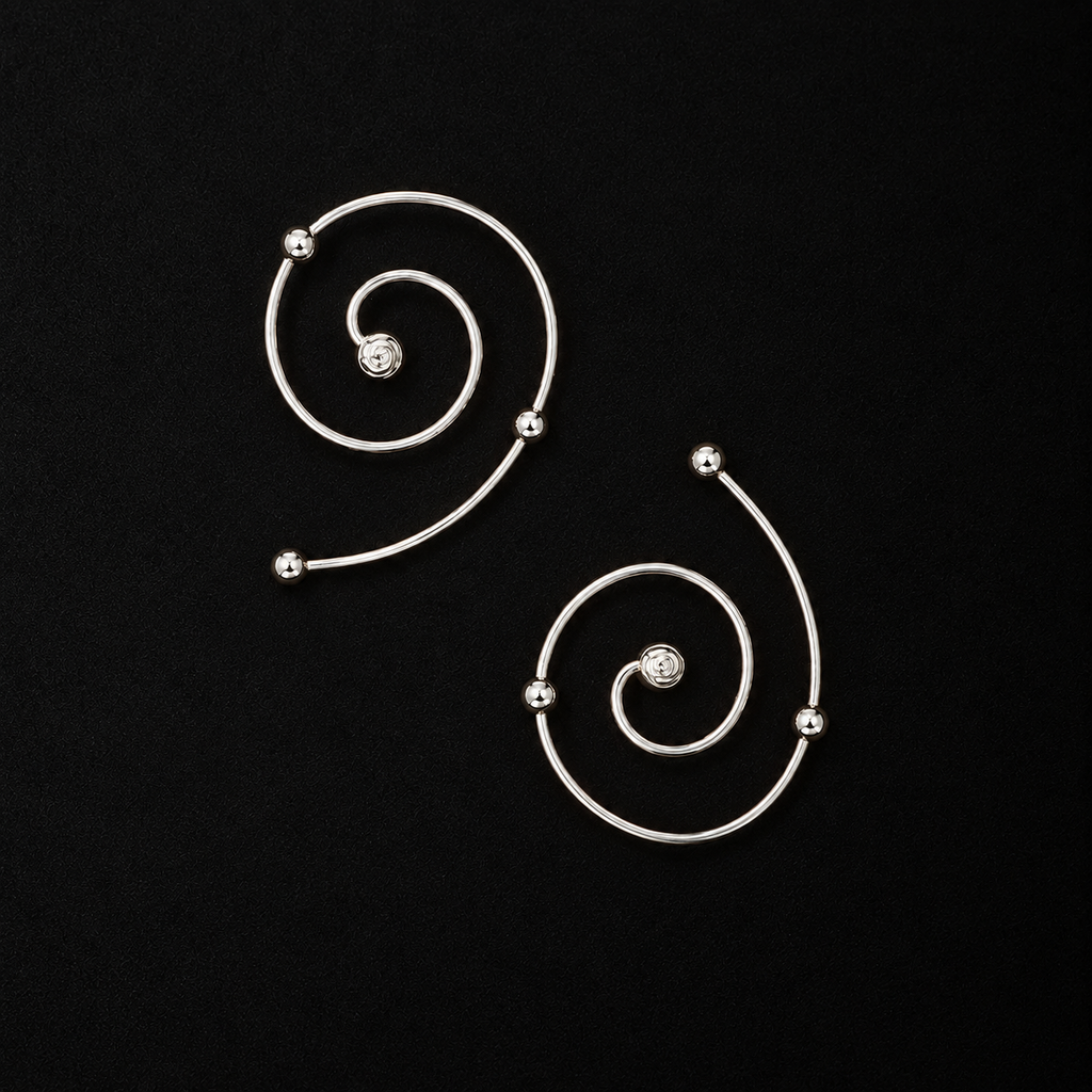 Front view of the Wire Spiral Ear Climbers in studio light