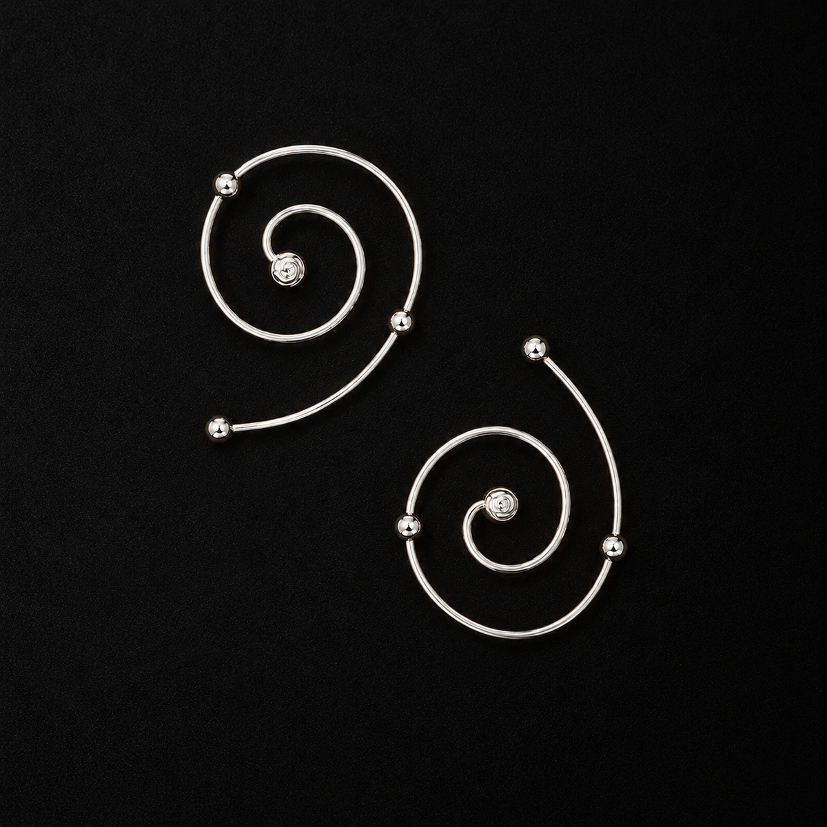 Front view of the Wire Spiral Ear Climbers in studio light