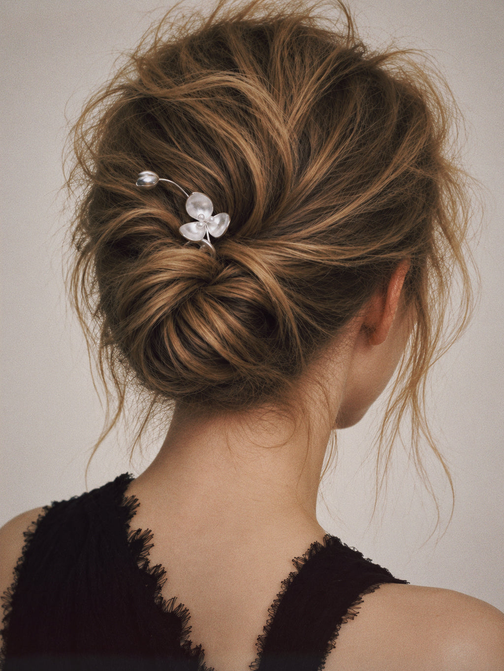 Detail view of the Wisp Orchid French Hair Pin, flower hair pin