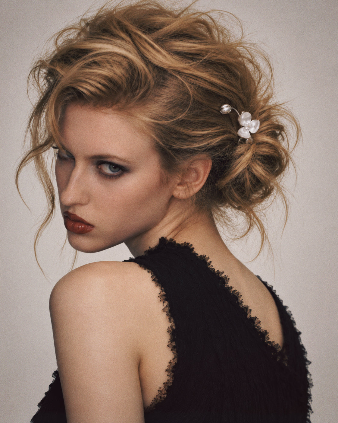 The Wisp Orchid French Hair Pin laid flat, a french hair pin in full view