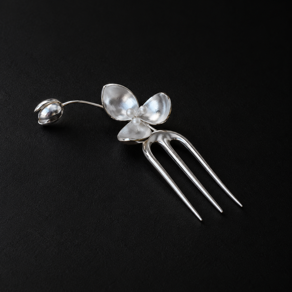 Wisp Orchid French Hair Pin worn in a low bun, french hair pin